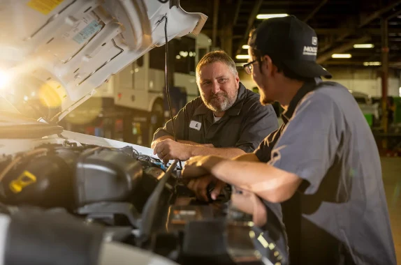 technicians working on a bus